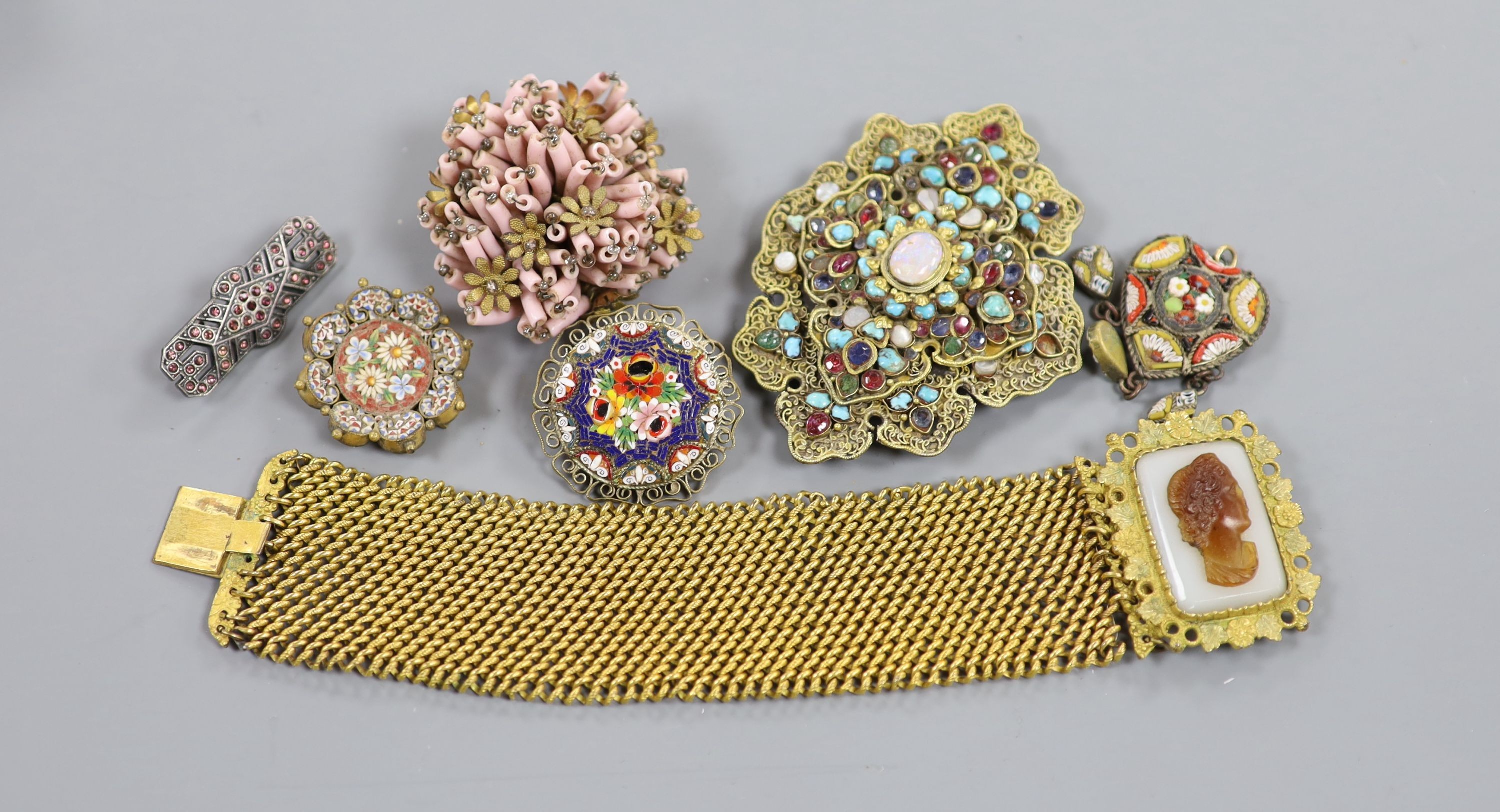 Seven items of Victorian and later jewellery, including a pinchbeck bracelet with hardstone cameo clasp, 18.2cm, a semi precious gem set Indian turban mount?, three micro mosaic items, etc.